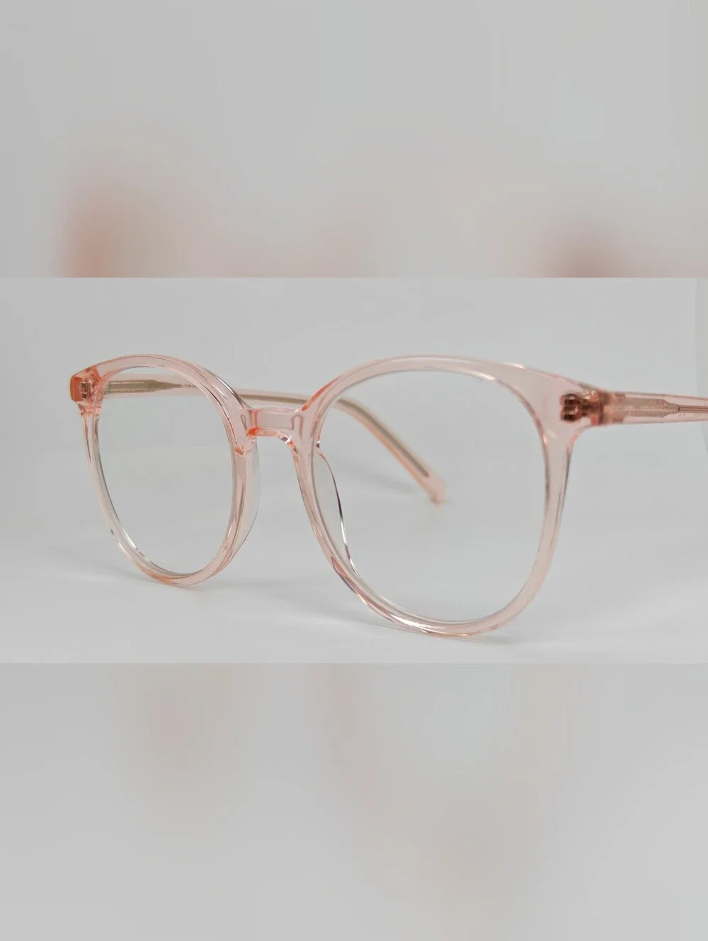 Noun. Transparent Pink Round Women's Eyeglasses. Minimalist..